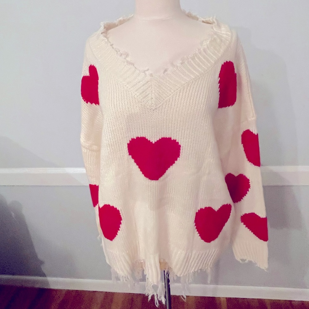 Knit sweater with red hearts